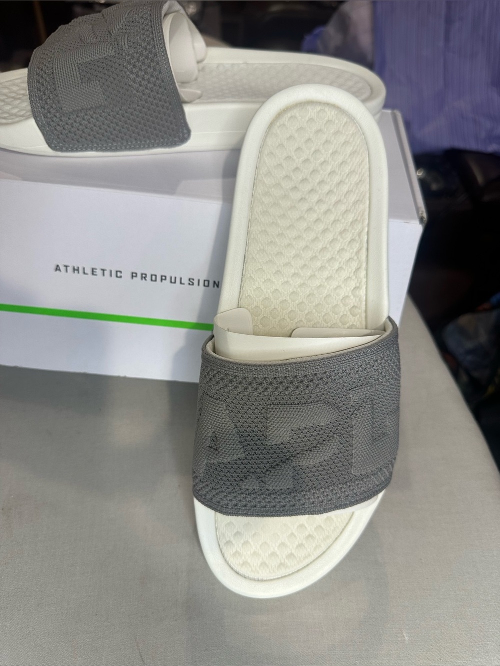 839. NEW SIZE 11 APL Gray and White Slide Sandals